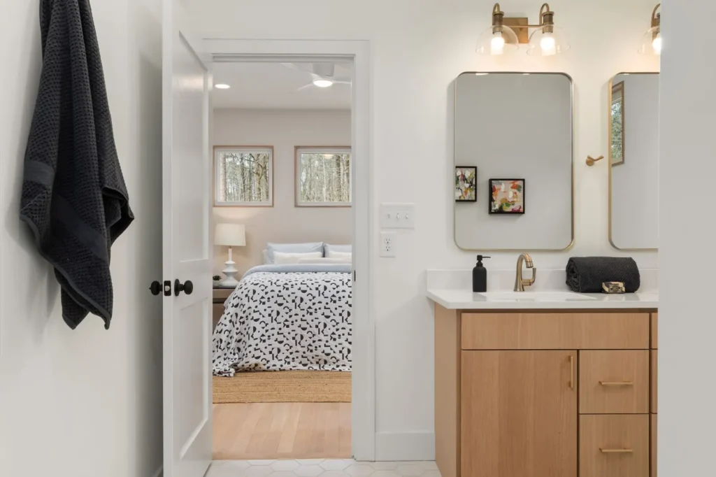 A ceiling-mounted bathroom exhaust fan that vents moist shower air outside the home