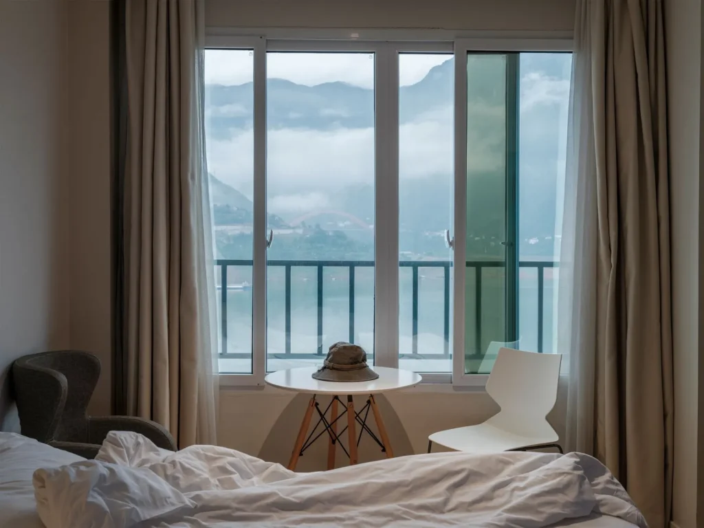 A cool mist humidifier running in a room with clear, condensation-free windows