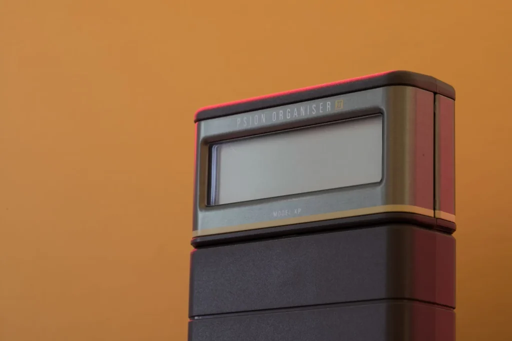 A digital hygrometer showing relative humidity as a percentage above the room temperature