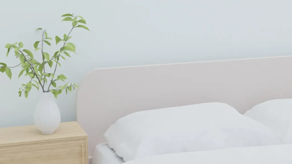 A cool-mist humidifier running on a bedroom nightstand with soft morning light