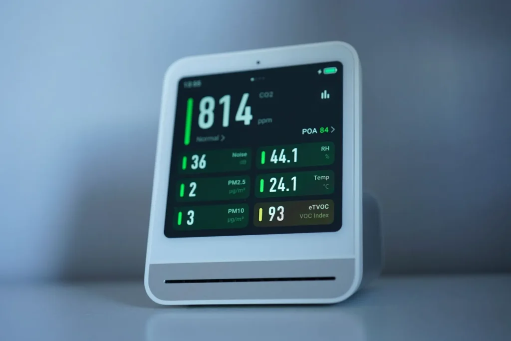 A digital hygrometer displaying a 45 percent relative humidity reading in a room