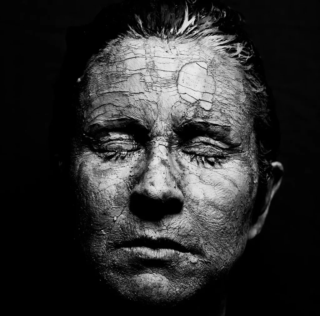 Close-up of an older adult's hands showing dry winter skin, illustrating why humidity matters for aging skin