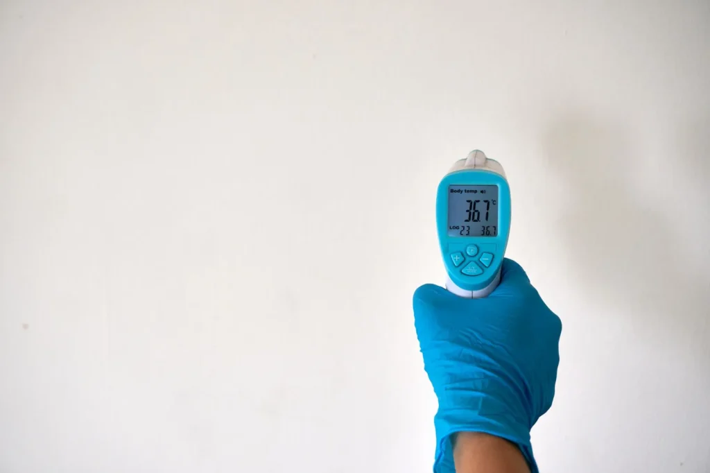 A small digital hygrometer displaying the relative humidity percentage in a child's room