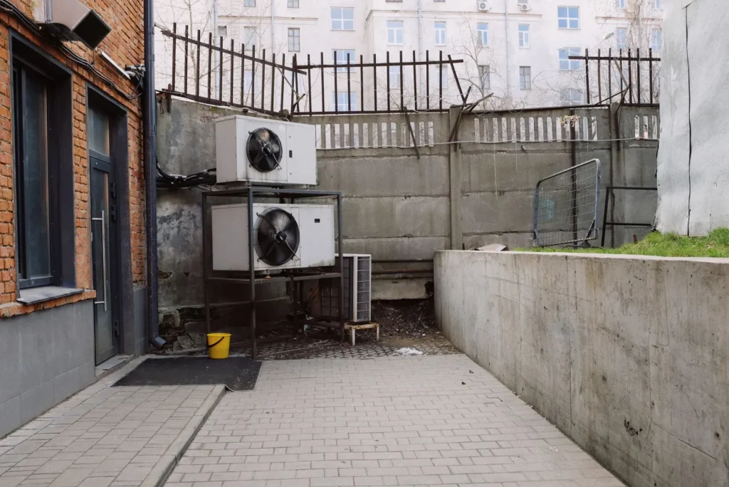 An energy recovery ventilator mounted in the mechanical room of a new home with insulated ducts connected