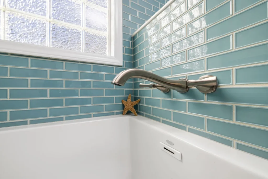 Flat white and gray mildew film on bathroom tile grout