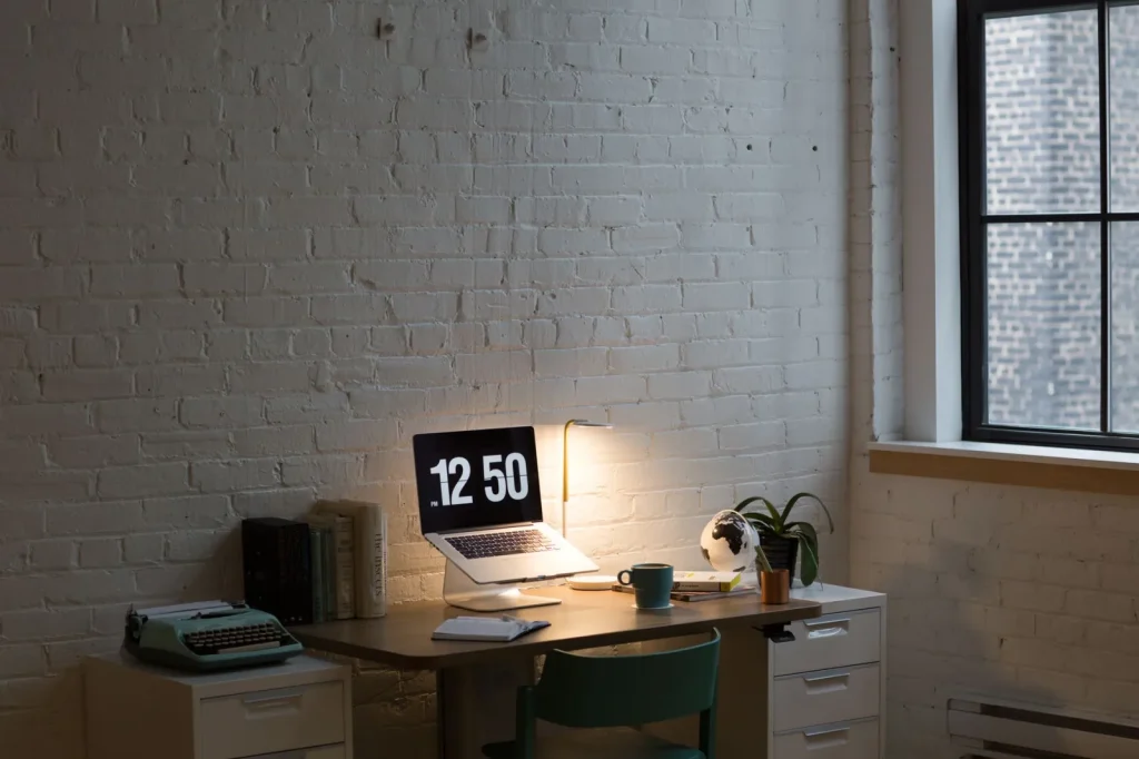 A digital hygrometer mounted on an interior wall showing a low relative humidity reading